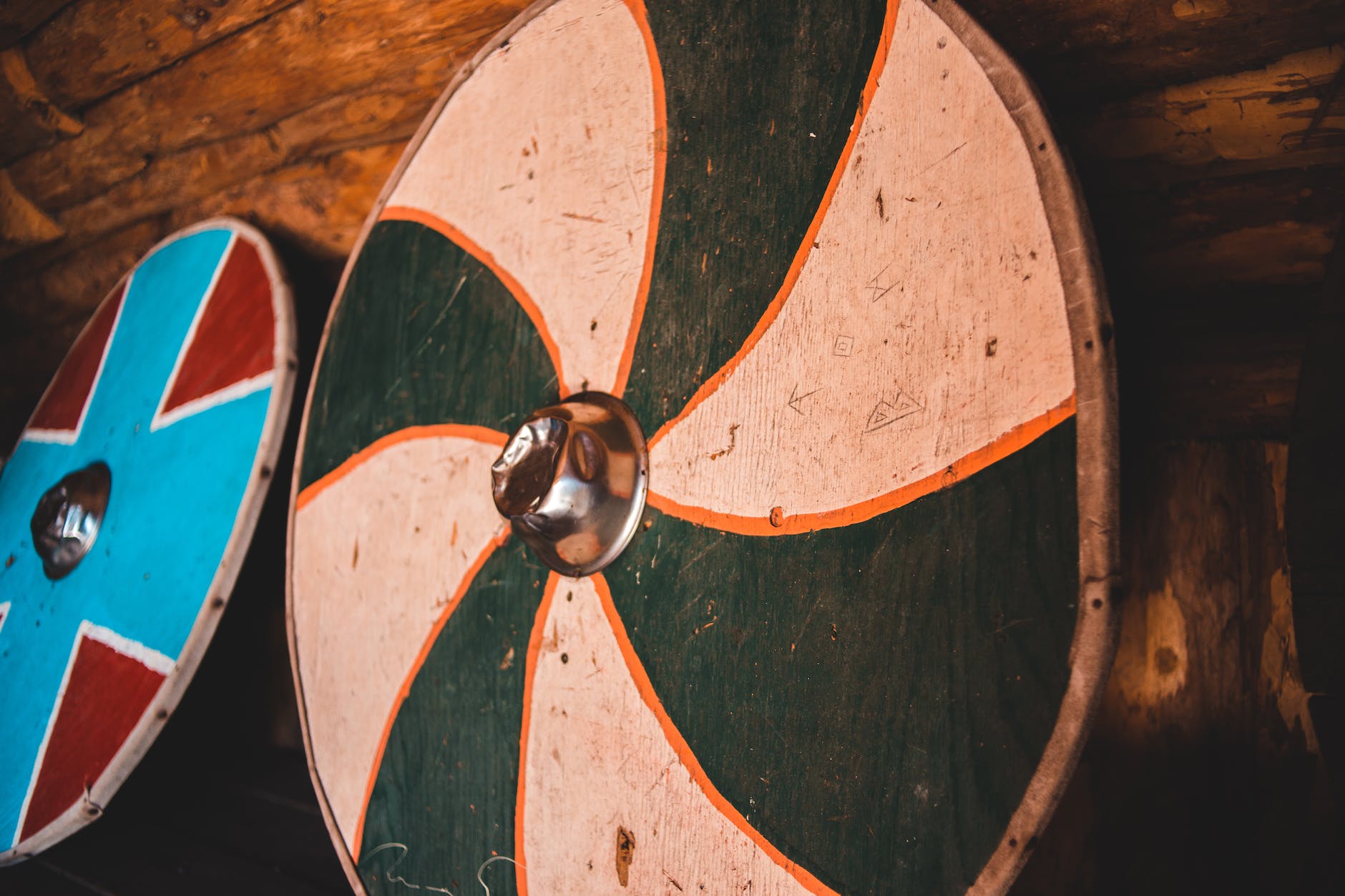 vintage round viking shields in wooden house