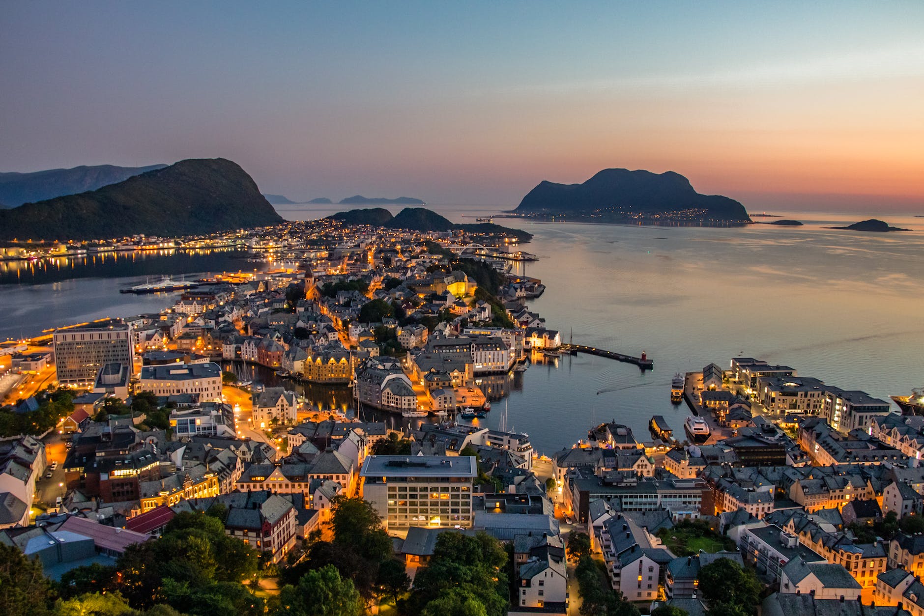 aerial photography of city beside sea