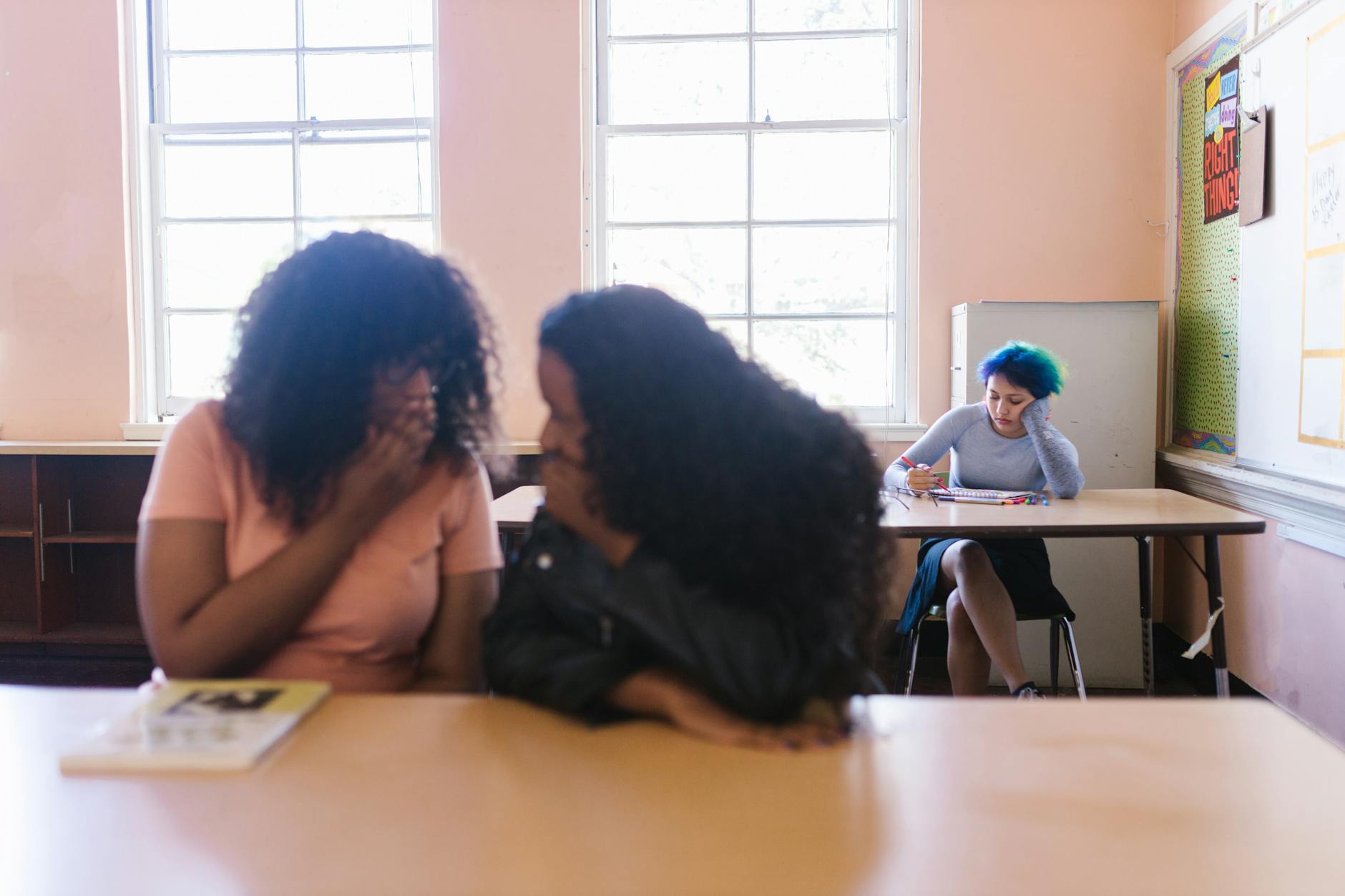 two women talking inside the classroom