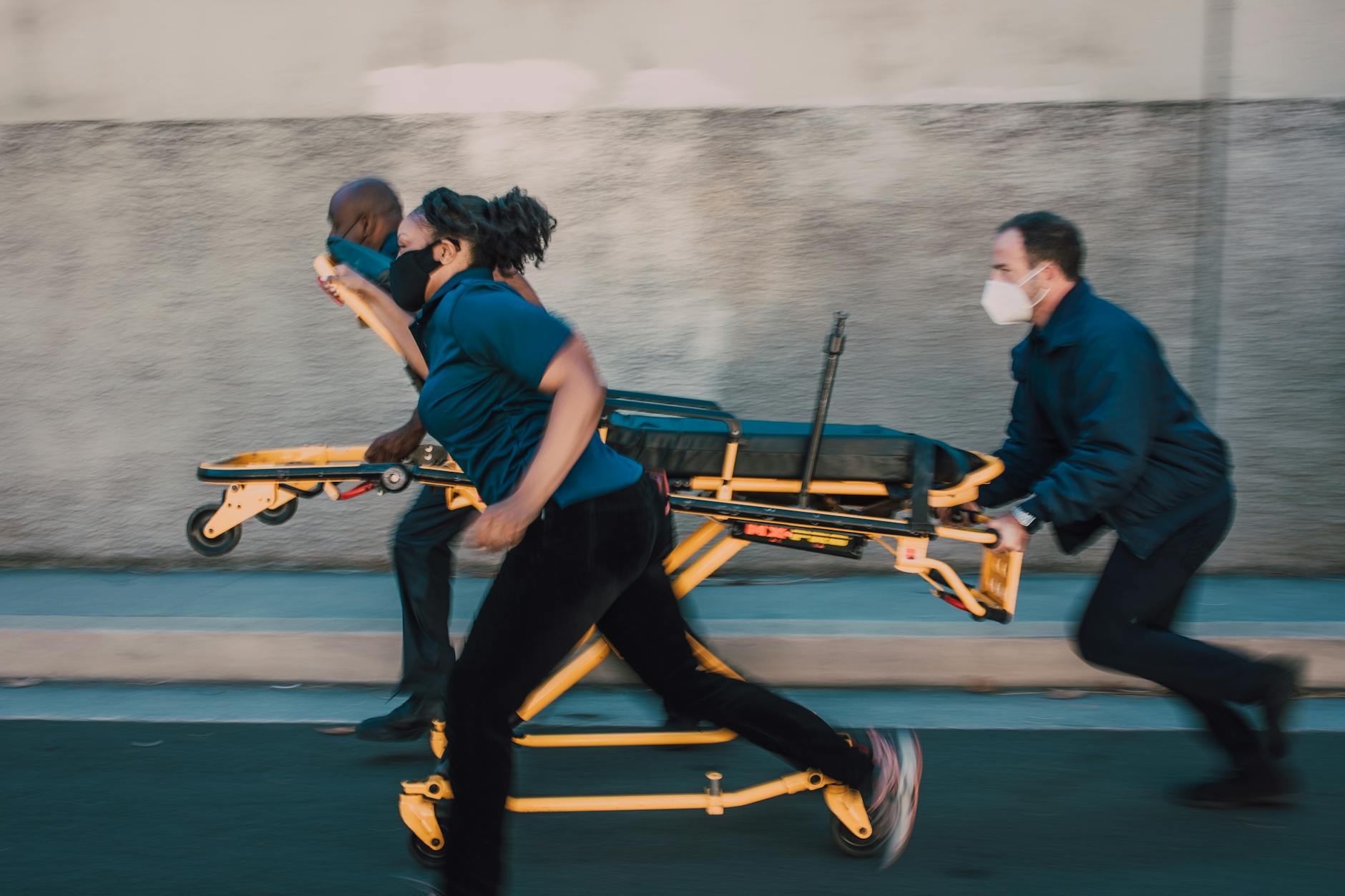 paramedics pushing a stretcher