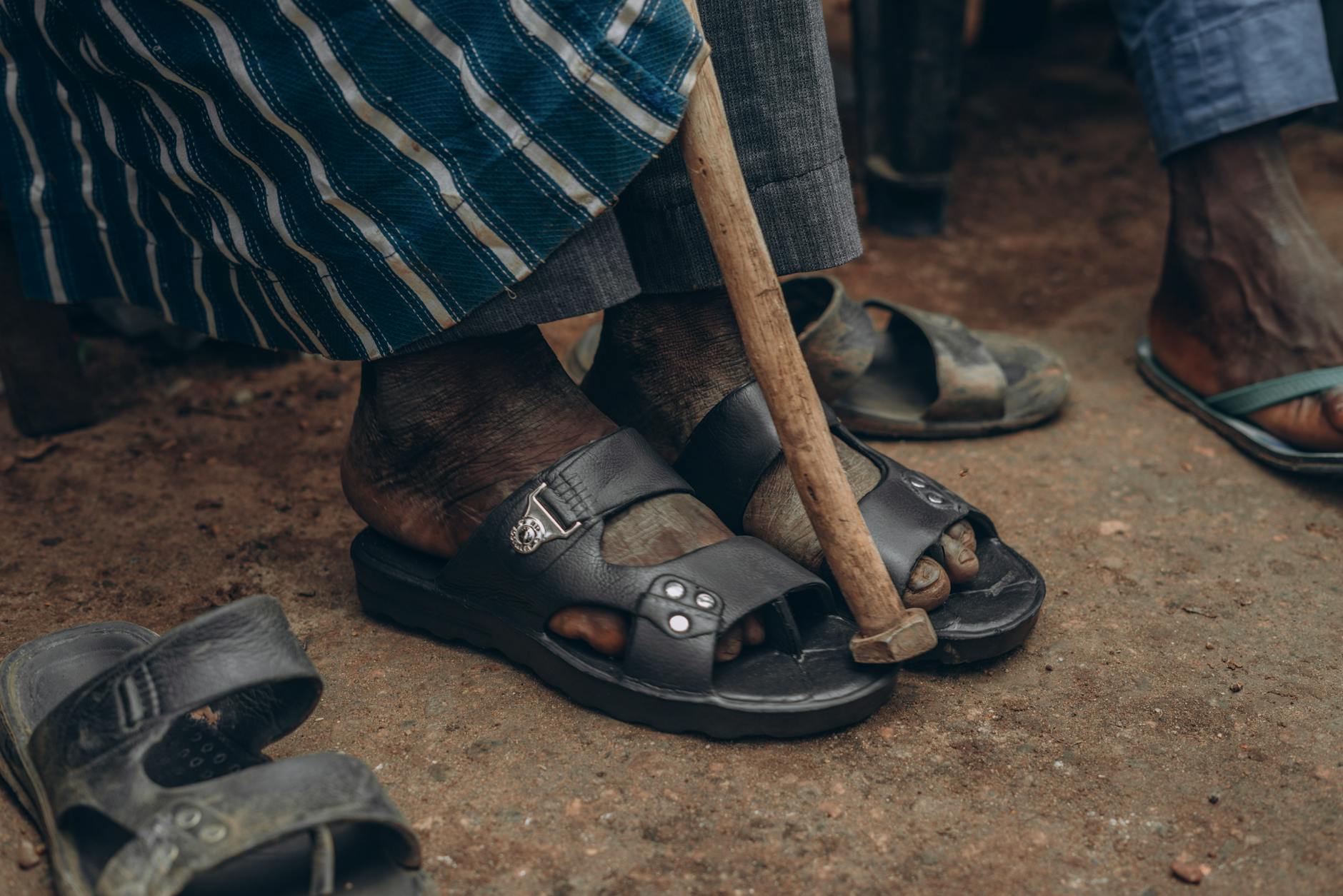 cultural footwear and walking cane close up