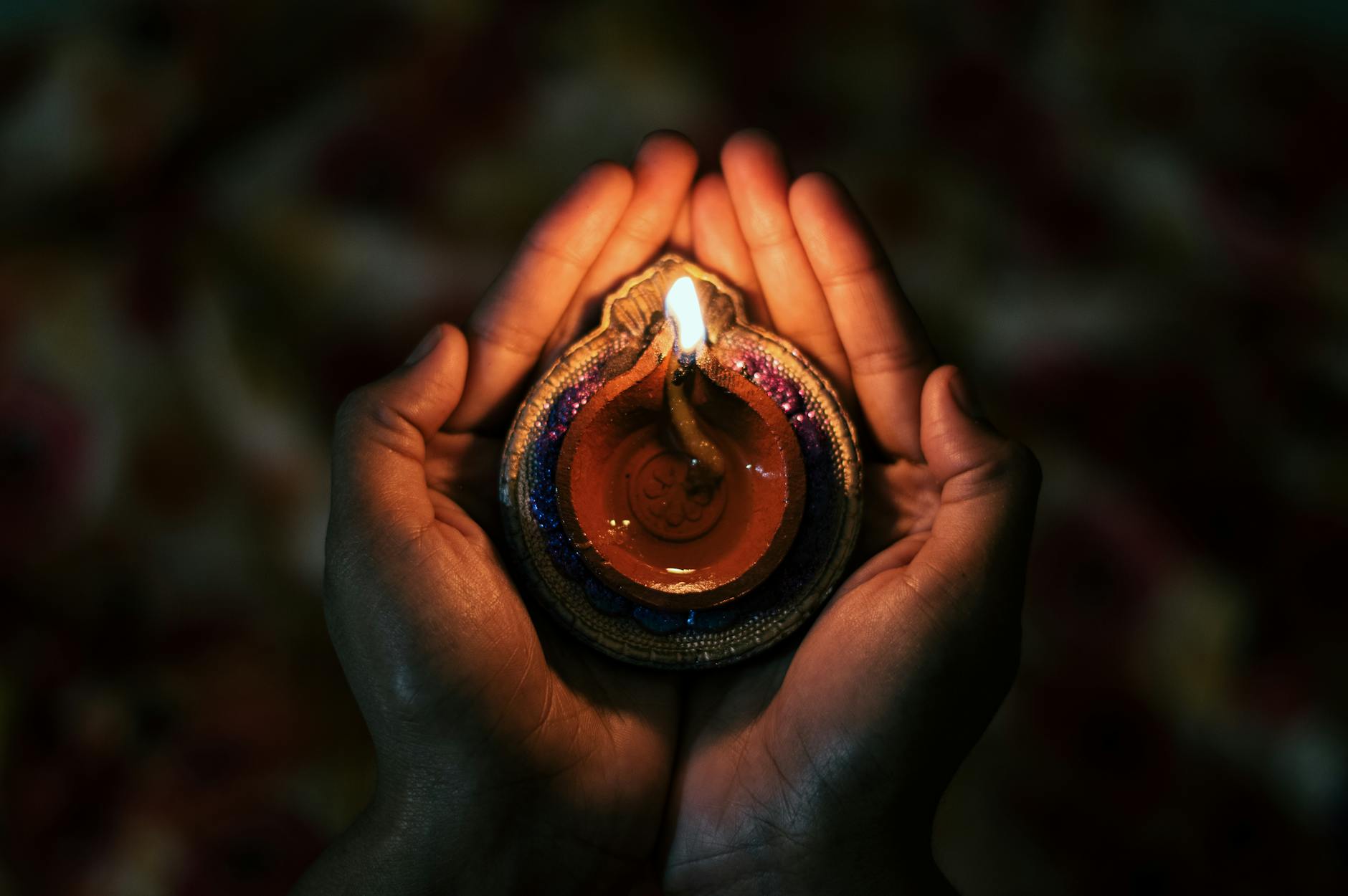 person with traditional candle in hands