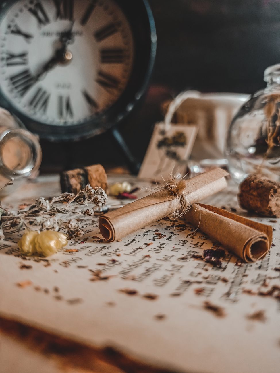 close up photo of rolled brown paper on top of an old paper
