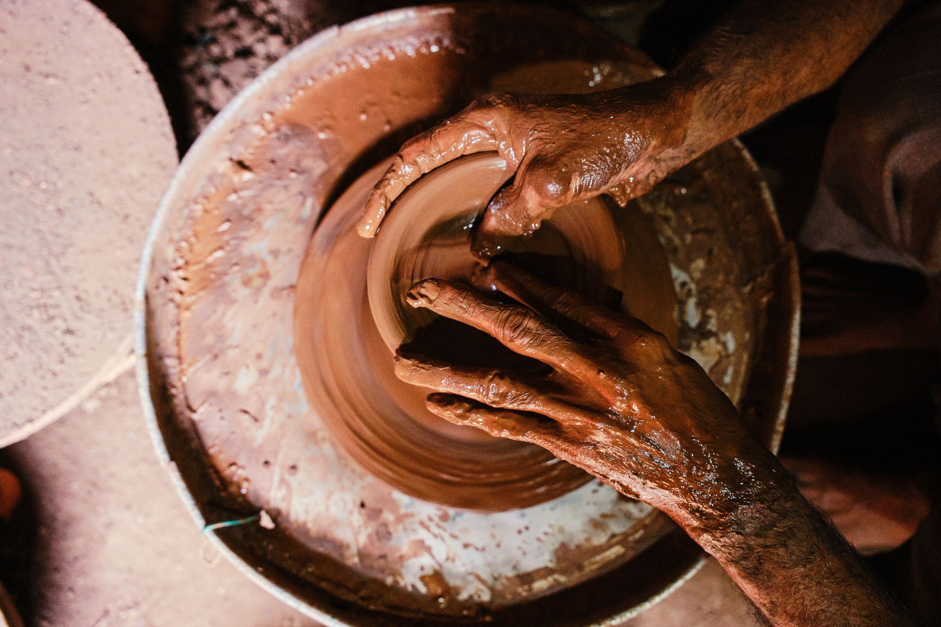 potter hands making clay pot